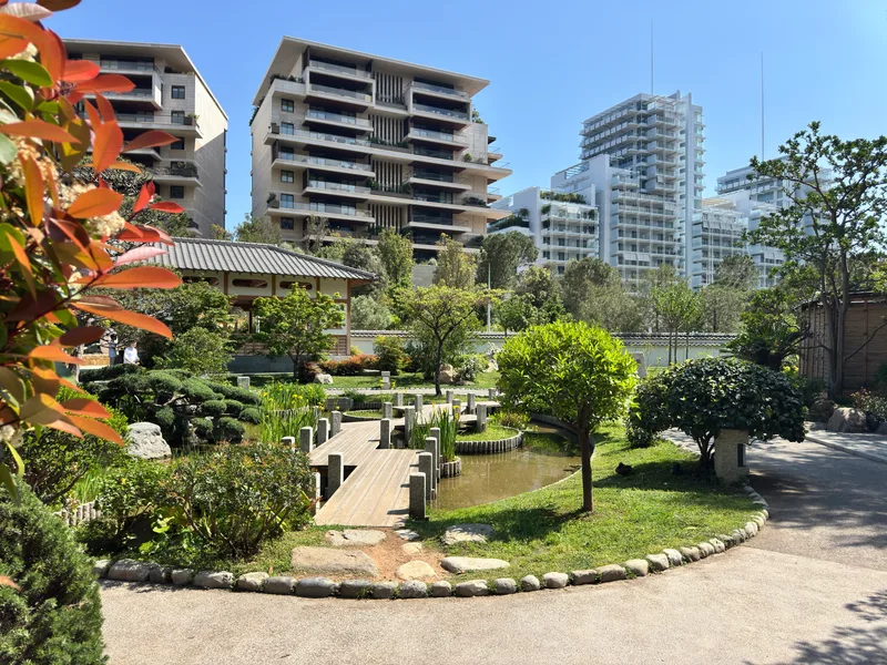 Monaco's Japanese Garden in its urban context, situated between Jardin d'Eau apartments, Le Renzo and the Grimaldi Forum exhibition centre