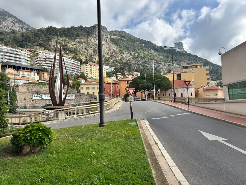 View from Monaco's border roundabout looking towards Roquebrune-Cap-Martin, with the Maybourne Riviera Hotel set high on the cliffs above the Riviera coastline